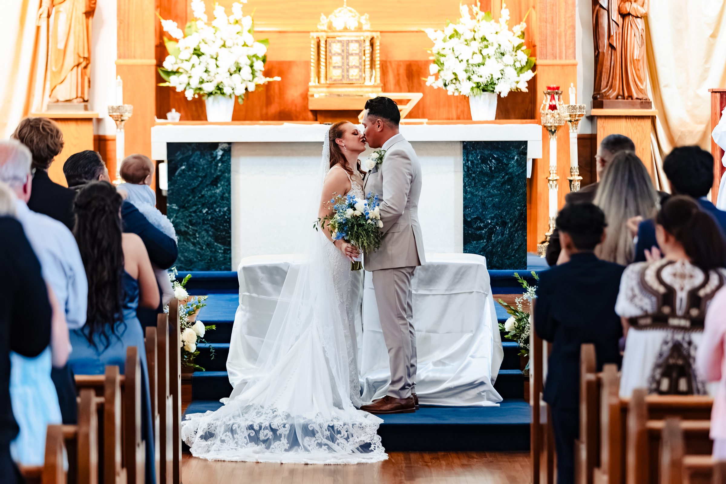 The first kiss as husband and wife at the altar