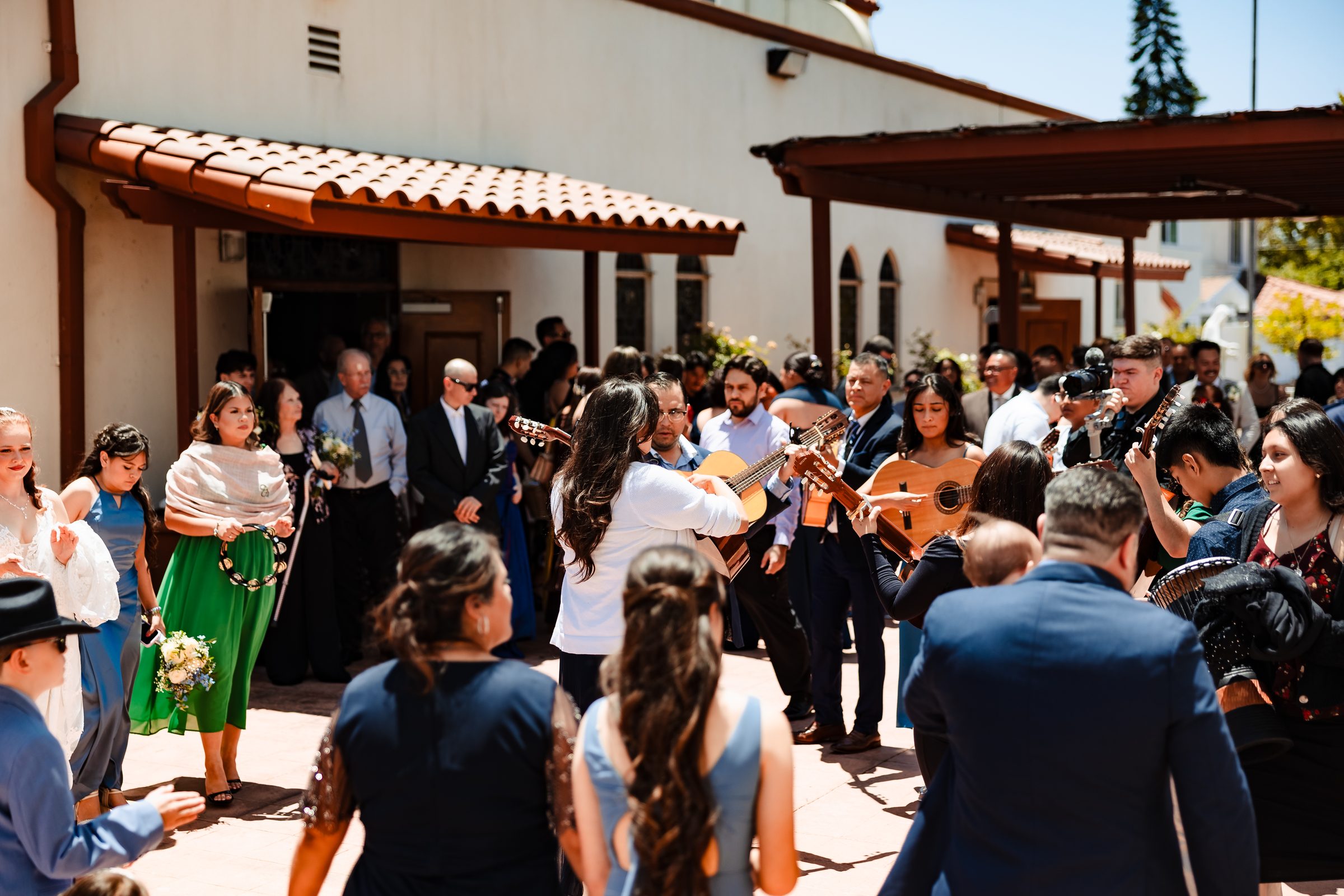 Mariachi playing for the newlyweds outside Saint Anne's