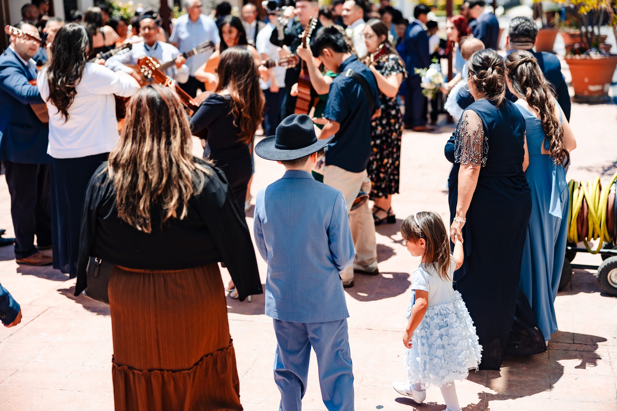 Guests gathered around the mariachi after the Mass
