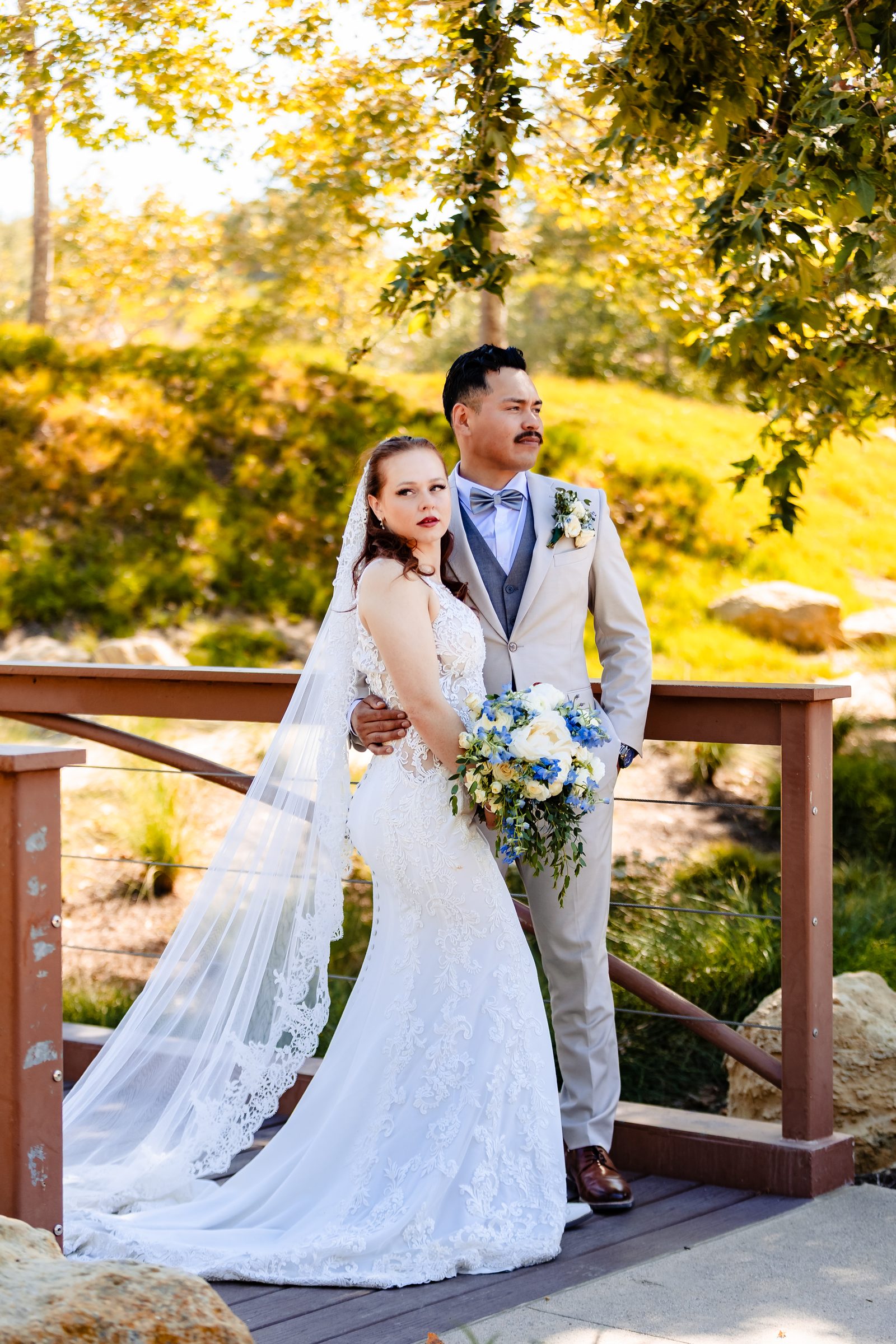 Bride and groom portrait on a wooden footbridge at Shady Oaks Canyon, Laguna Hills