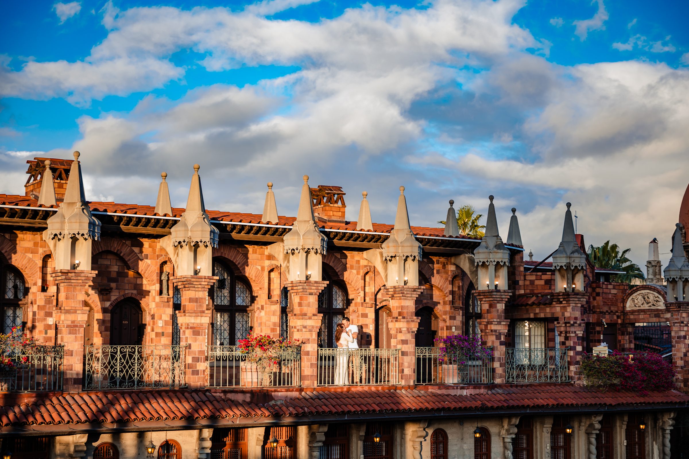 The Mission Inn rooftops and towers beneath a blue sky, Riverside
