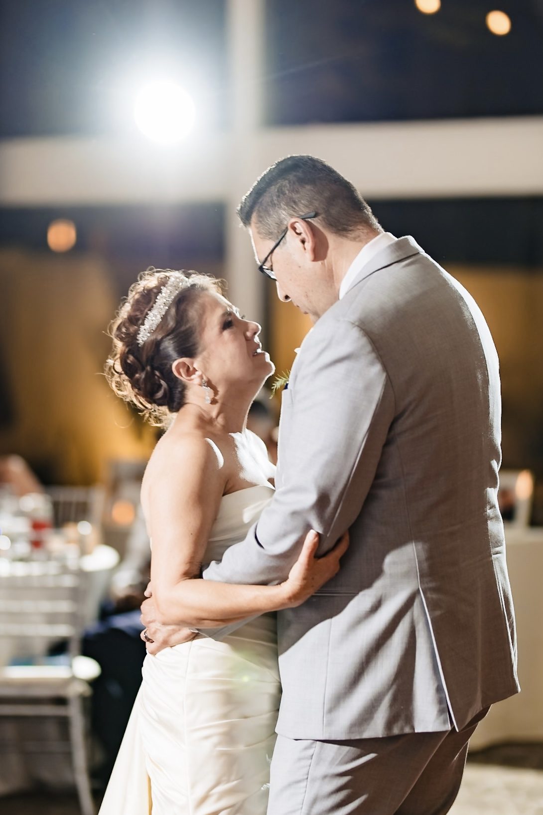 Victoria looking up at Joe during their first dance at The Odyssey