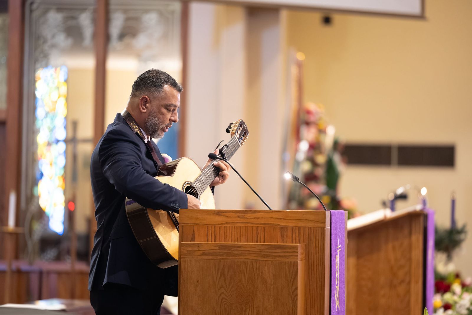 A father of the couple cantoring at the ambo during the Nuptial Mass