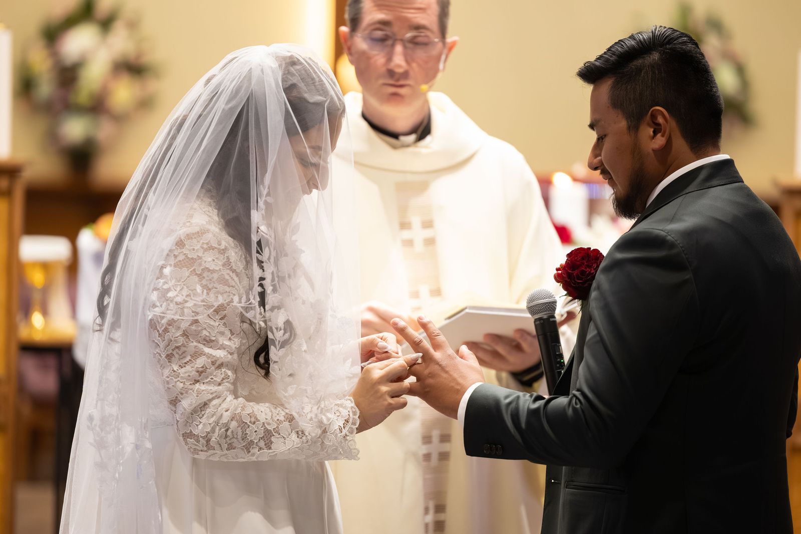 Manny and Lauren exchange rings during their Catholic Nuptial Mass