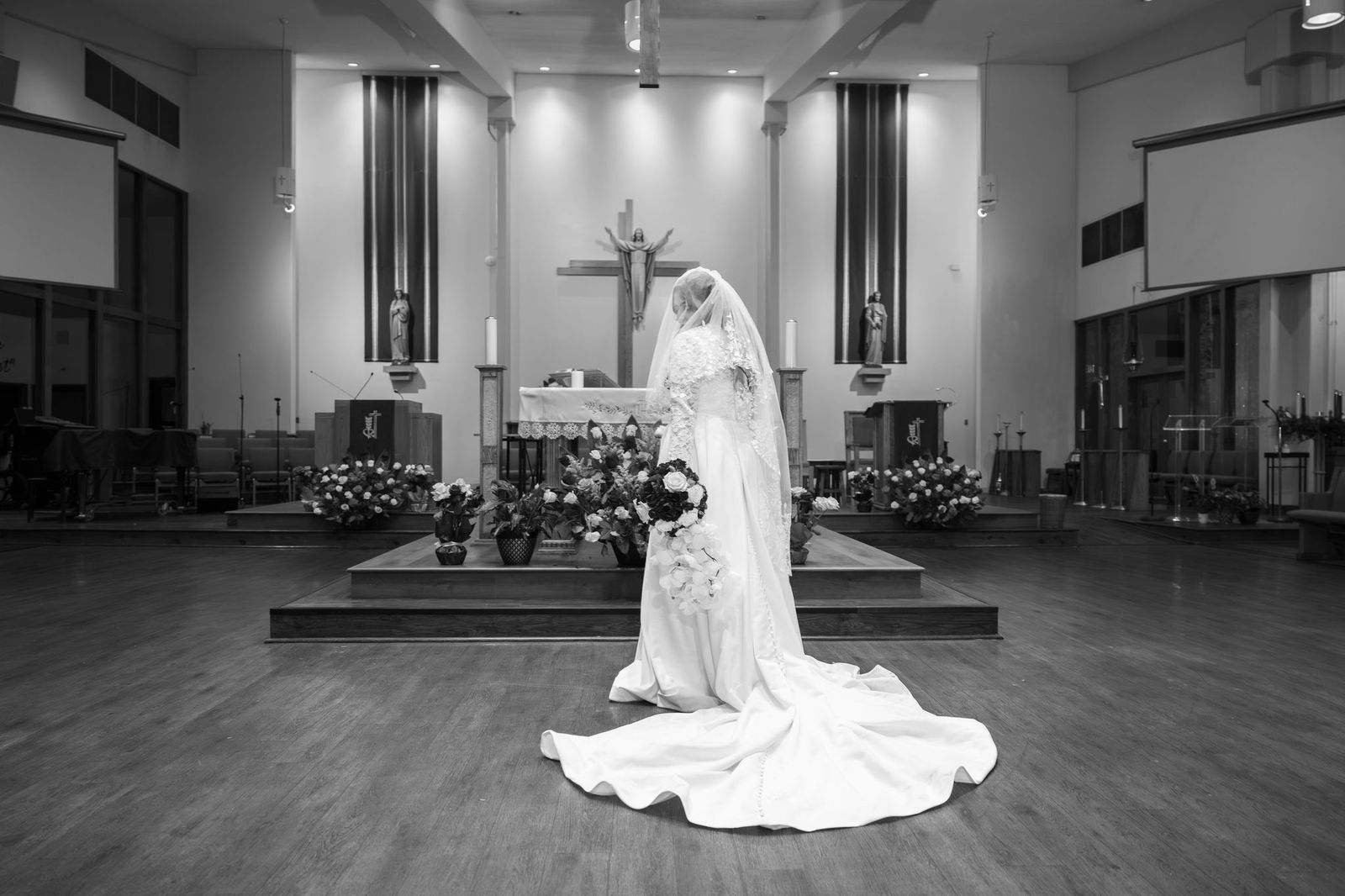 Lauren in her wedding gown, a black and white portrait after her Catholic wedding