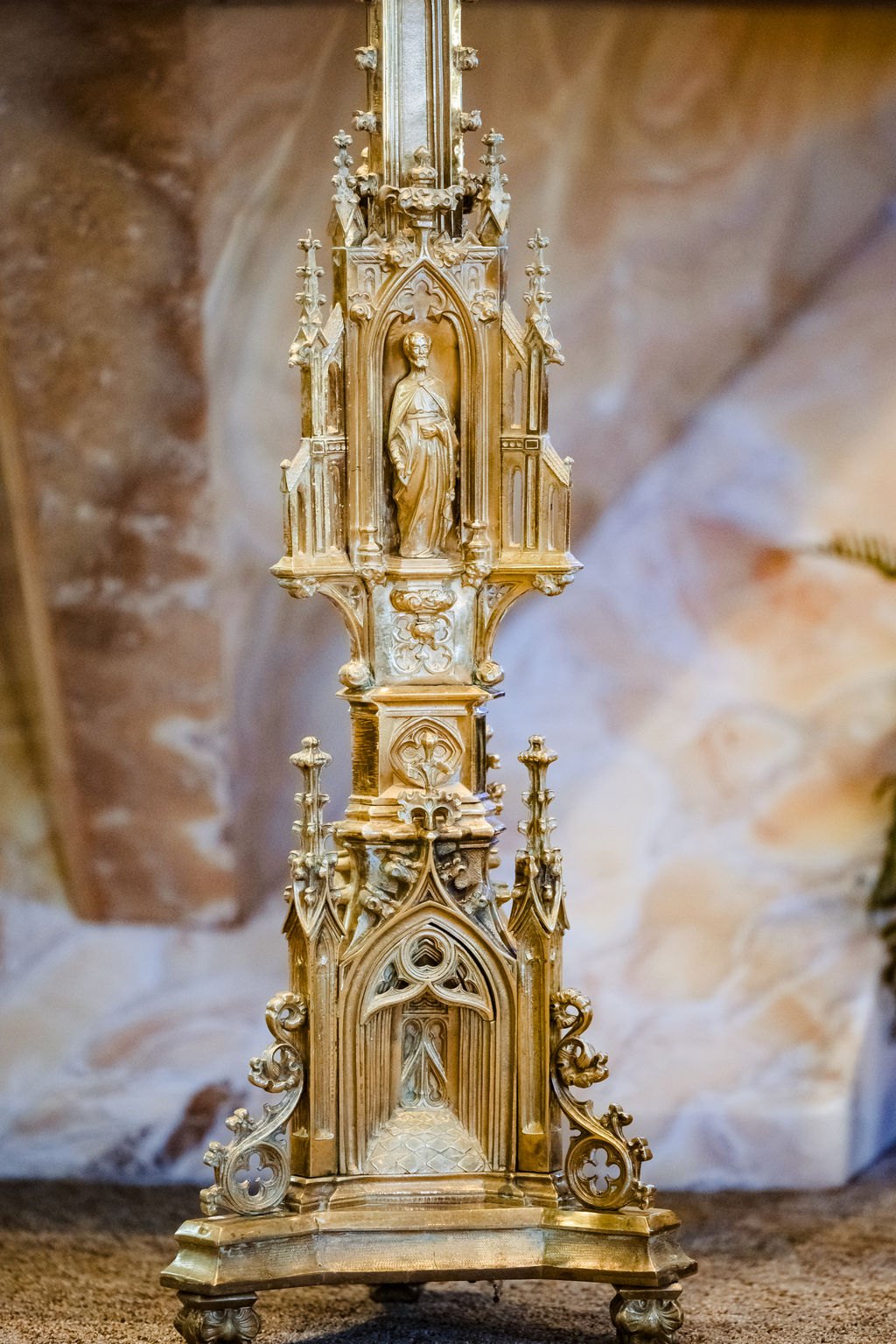 A gilded Gothic candlestick on the altar