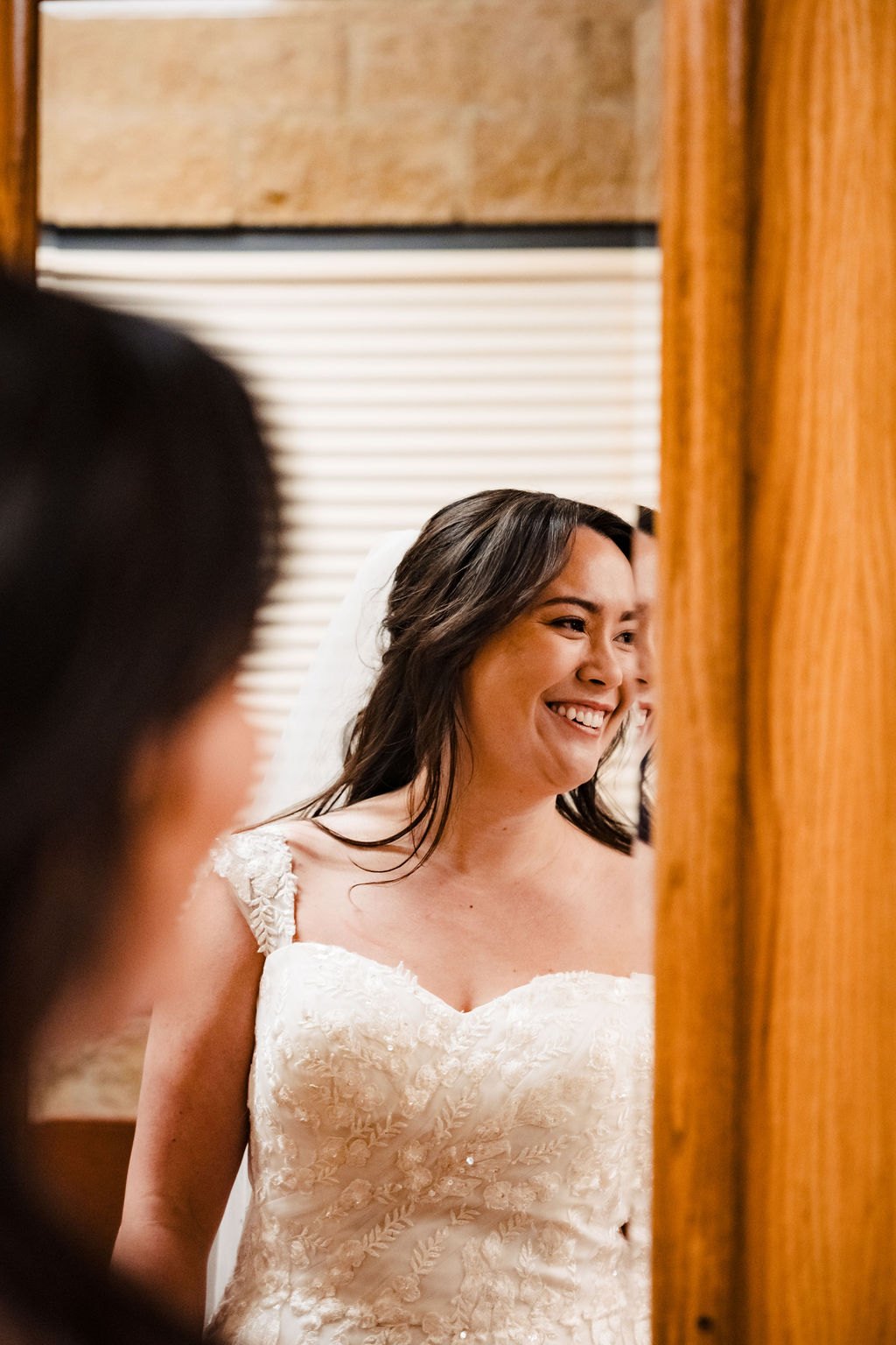 Ginger smiling in the doorway before the ceremony