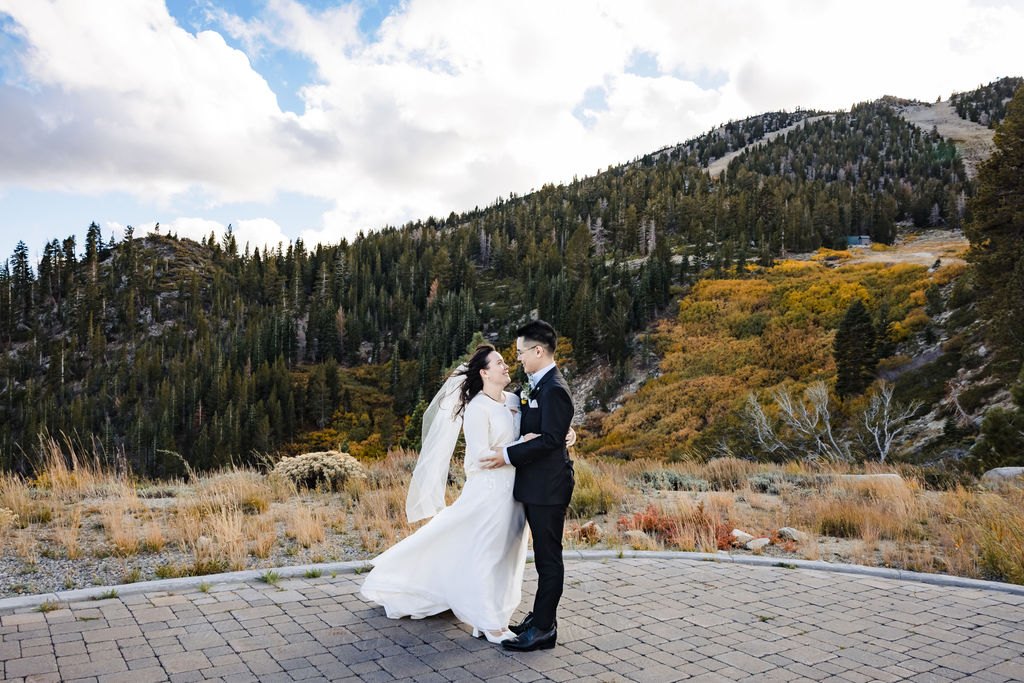 Vincent and Ginger on a mountain overlook with autumn color behind them