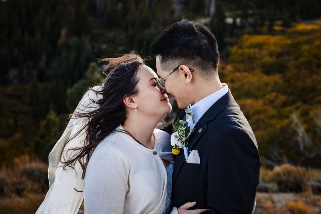 A close kiss in the mountain wind