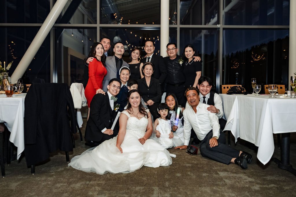 The whole wedding party gathered together at the reception